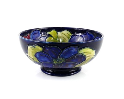 Lot 170 - A Moorcroft Clematis pattern pottery proud...