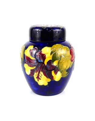 Lot 174 - A Moorcroft Hibiscus pattern pottery ginger...