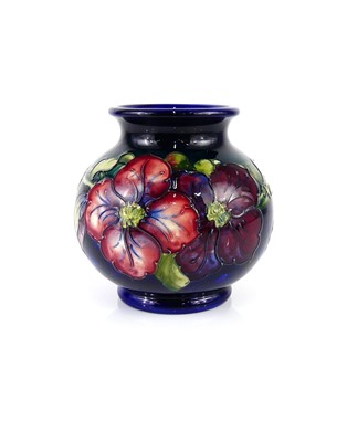 Lot 177 - A Moorcroft Clematis pattern pottery vase, of...