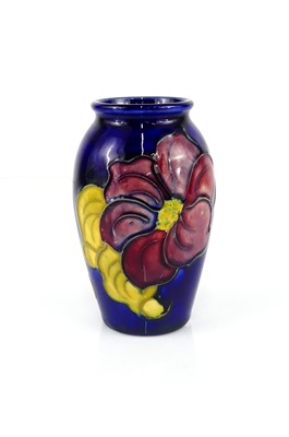 Lot 230 - A small Moorcroft Anemone pattern pottery vase,...