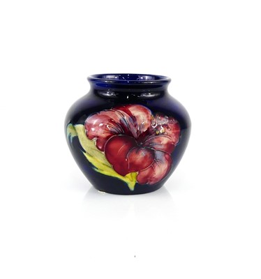 Lot 180 - A Moorcroft Hibiscus pattern pottery miniature...