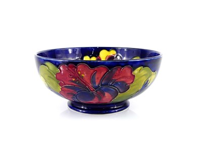 Lot 182 - A Moorcroft Hibiscus pattern pottery footed...