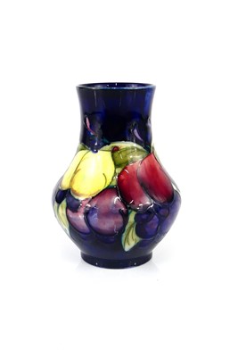 Lot 231 - A small Moorcroft Wisteria pattern pottery...