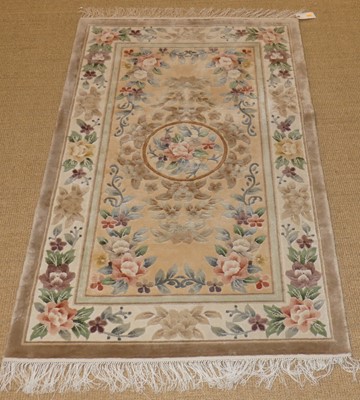 Lot 752 - A Chinese superwash rug, with beige ground and...