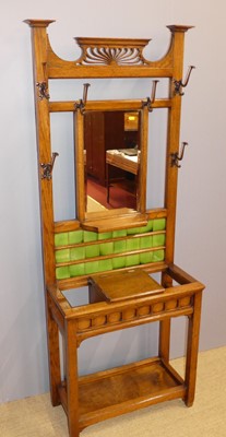 Lot 733 - An early 20th century oak and mirror inset...