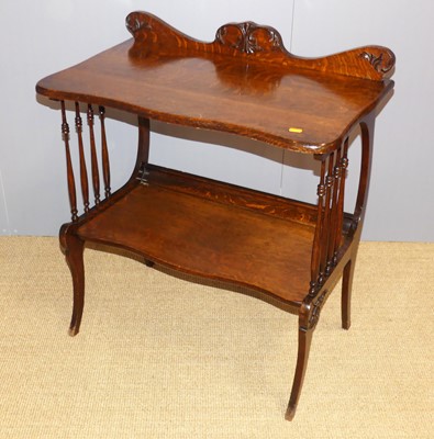 Lot 720 - An Art Nouveau oak two-tier side table, in the...