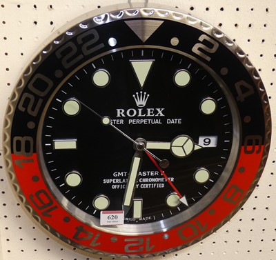 Lot 620 - A reproduction novelty wall clock, in the form...