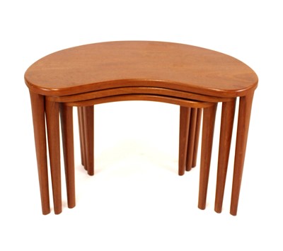 Lot 386 - A 1960s teak kidney shaped nest of three...