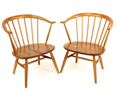 Lot 396 - A pair of 1960s Ercol blond elm and beech 'Cow...