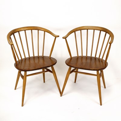 Lot 397 - A pair of 1960s Ercol blond elm and beech 'Cow...