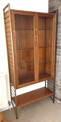 Lot 392 - A 1970s Ladderax teak and painted metal double...