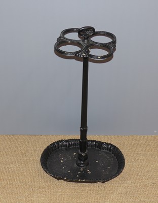 Lot 674 - A Victorian black painted cast iron umbrella...