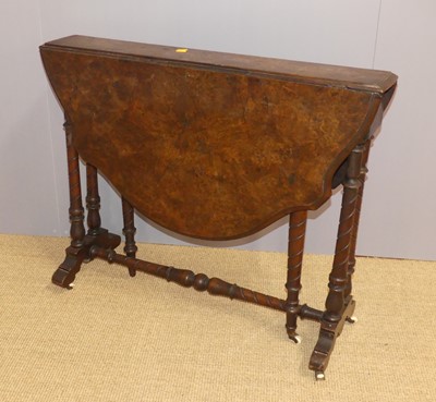 Lot 636 - A Victorian walnut shaped top Sutherland table,...