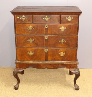 Lot 725 - An 18th century figured walnut chest on stand,...