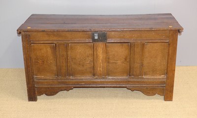Lot 719 - A 18th century joined oak four panel hinge-top...
