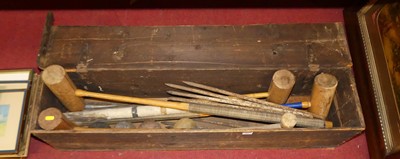 Lot 591 - A circa 1900 croquet set, including four...