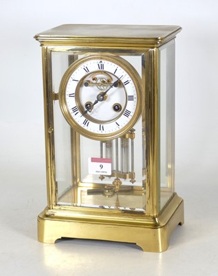 Lot 9 - A 19th century lacquered brass four glass...