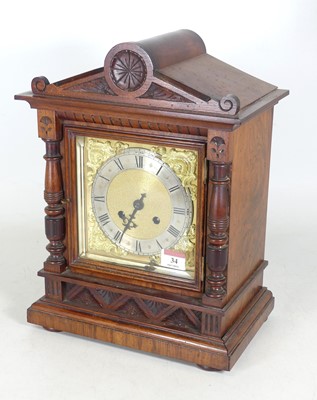 Lot 34 - An Edwardian walnut cased mantel clock, the...