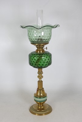 Lot 51 - An early 20th century oil lamp, having a...