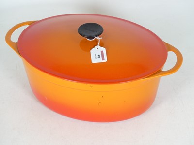 Lot 59 - A Cousances orange enamelled cast iron...