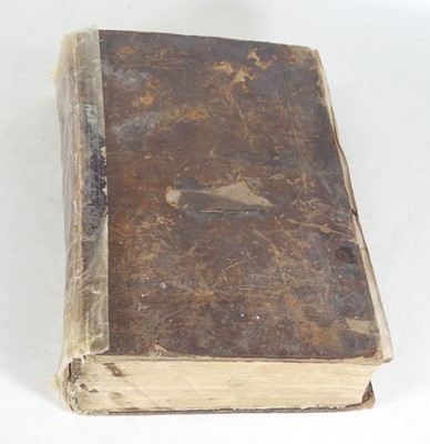 Lot 70 - An early 19th century bible, bound in tan...