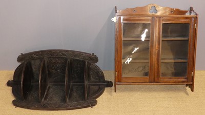 Lot 727 - A circa 1900 carved oak hanging corner shelf,...