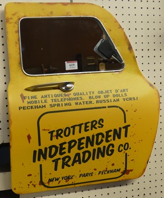 Lot 619 - A contemporary novelty metal wall mirror, in...