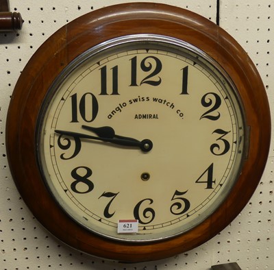 Lot 621 - A walnut circular wall clock, the white dial...