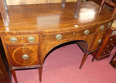 Lot 647 - A 19th century mahogany bow front kneehole...