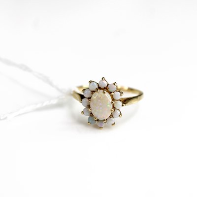 Lot 296 - A 9ct gold cabochon opal set flower head...