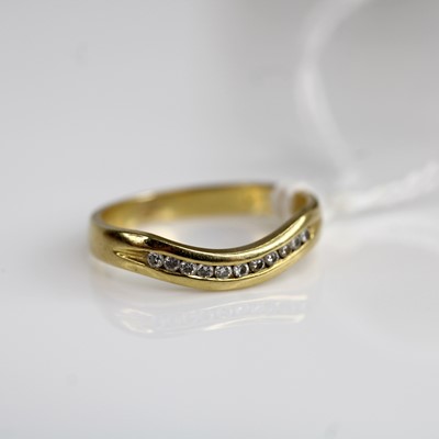 Lot 299 - A modern 18ct gold and diamond half eternity...