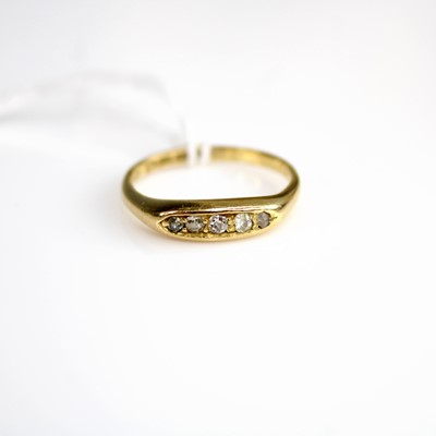 Lot 302 - An 18ct gold diamond dress ring, arranged as...