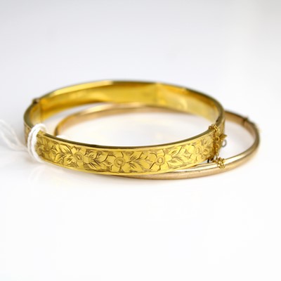 Lot 317 - A 9ct hollow rose gold bangle, dia.6.2cm;...