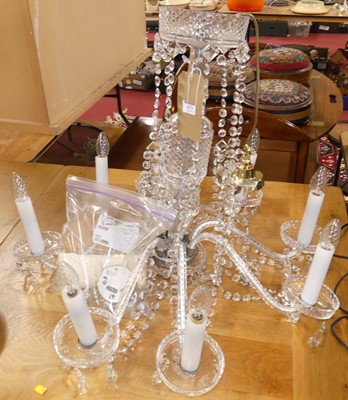 Lot 673 - A cut crystal glass hanging eight light...