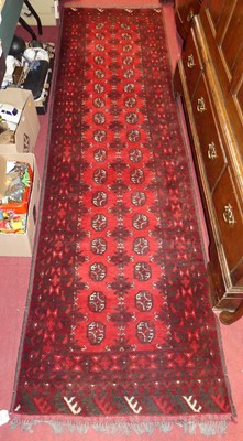 Lot 741 - A Persian woollen red ground Bokhara hall...