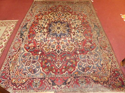 Lot 747 - A Persian woollen blue, red and cream ground...