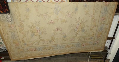 Lot 753 - A French cream ground woollen Aubusson rug
