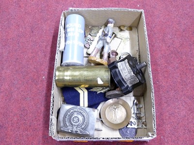 Lot 267 - A collection of militaria, to include a cap...