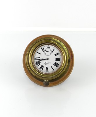 Lot 330 - An early 20th century Dunhill brass circular...