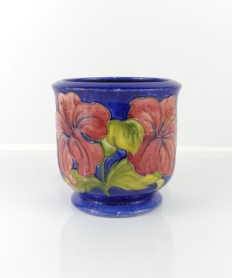 Lot 203 - A Moorcroft Hibiscus pattern pottery footed...