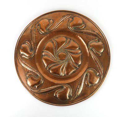 Lot 337 - An Arts & Crafts embossed and hammered copper...