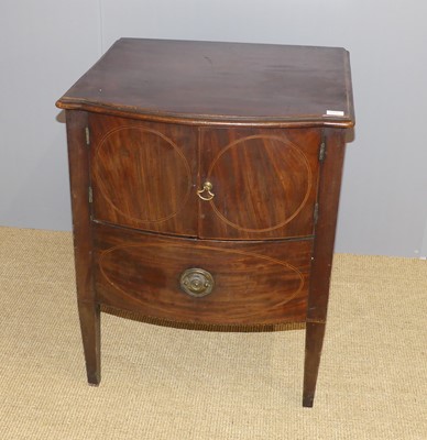 Lot 670 - A George III mahogany two-door night commode,...
