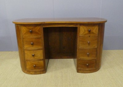 Lot 383 - A continental Art Deco walnut kidney shaped...