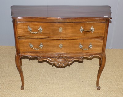 Lot 652 - A continental walnut serpentine front two...