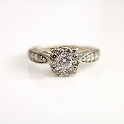Lot 246 - A 9ct white gold diamond halo cluster ring,...