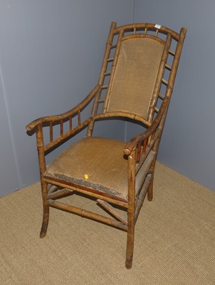 Lot 689 - A bamboo and woven wicker inset open elbow...