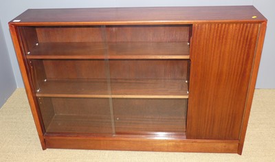 Lot 761 - A 1970s hardwood low bookshelf, having twin...