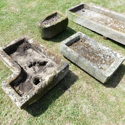 Lot 608 - A reconstituted stone corner trough; together...