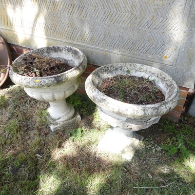 Lot 605 - A pair of reconstituted stone pedestal...