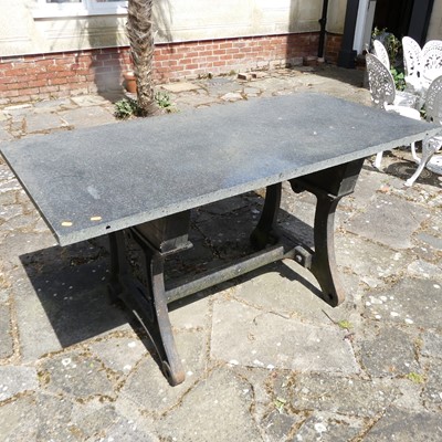 Lot 672 - A garden table as a polished slate slab upon...